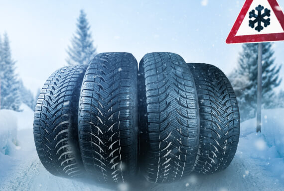Stack of high-quality winter tires designed for snow and icy road conditions at The Tire Studio